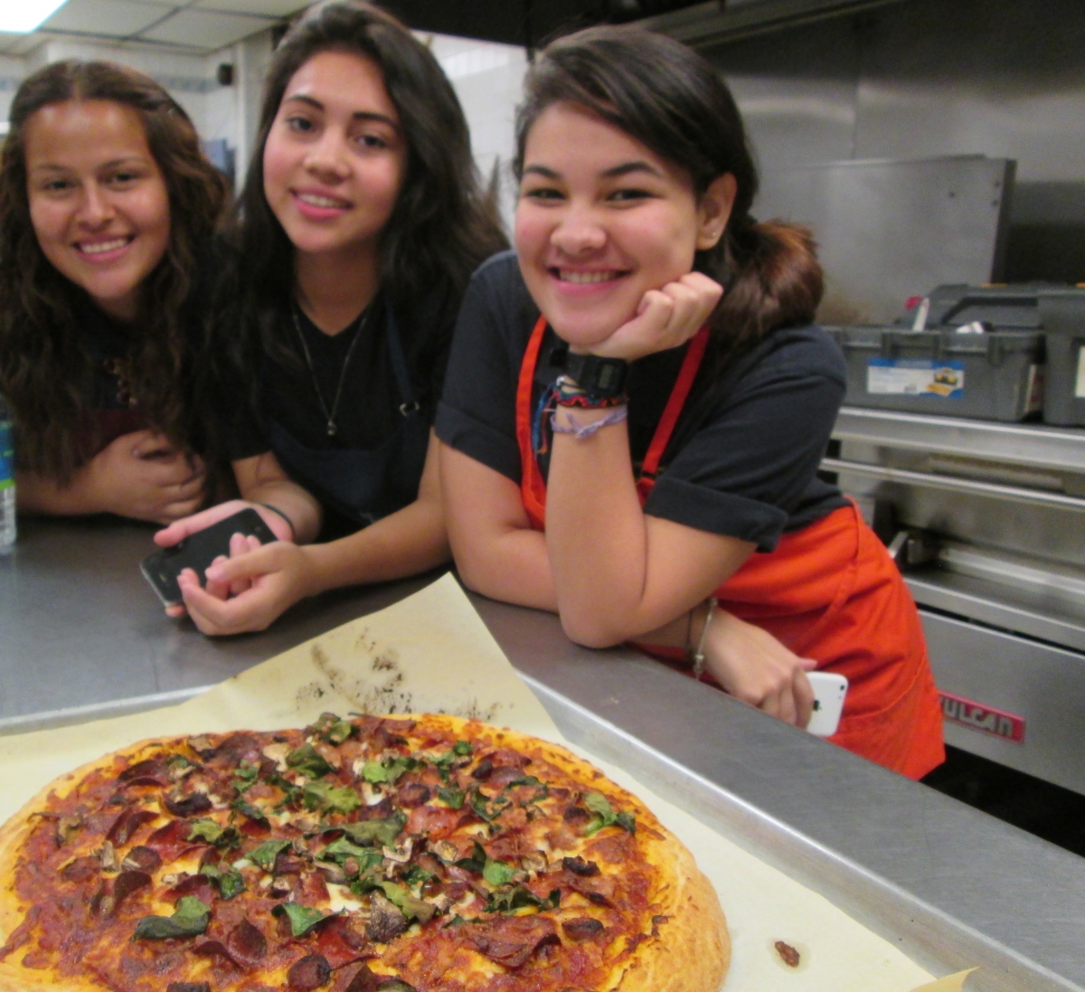 Photo of participants with pizza