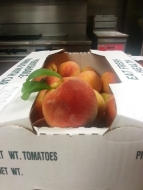 A delicious box of peaches for clients from Bounty Hill Farms