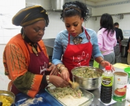 Auntie Oye and Loo putting the fish dish together 