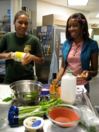 Aja and Symone making salad dressing