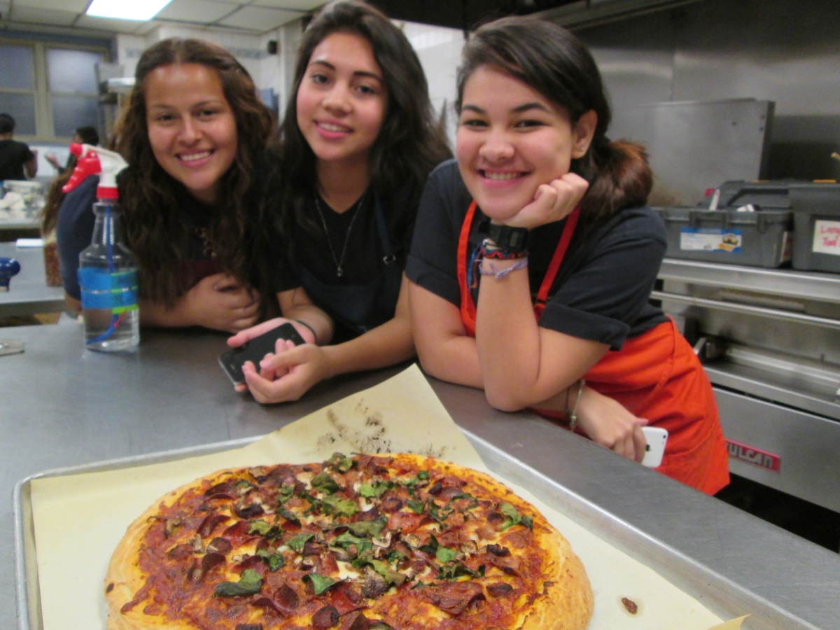 Proud participants with their pizza